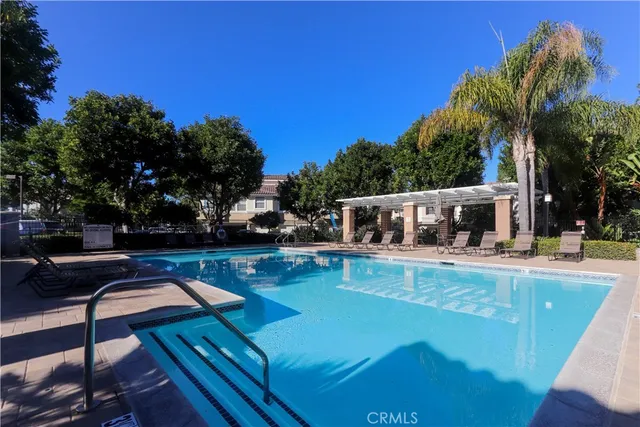 a view of a swimming pool with a yard