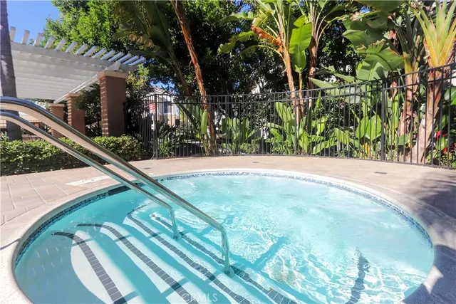 a swimming pool with outdoor seating and yard