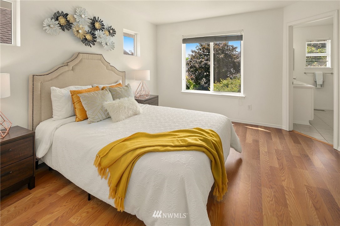 34805 Southeast Ridge Street Snoqualmie, WA 98065 - Photo 22 of 40 a bedroom with a bed and wooden floor
