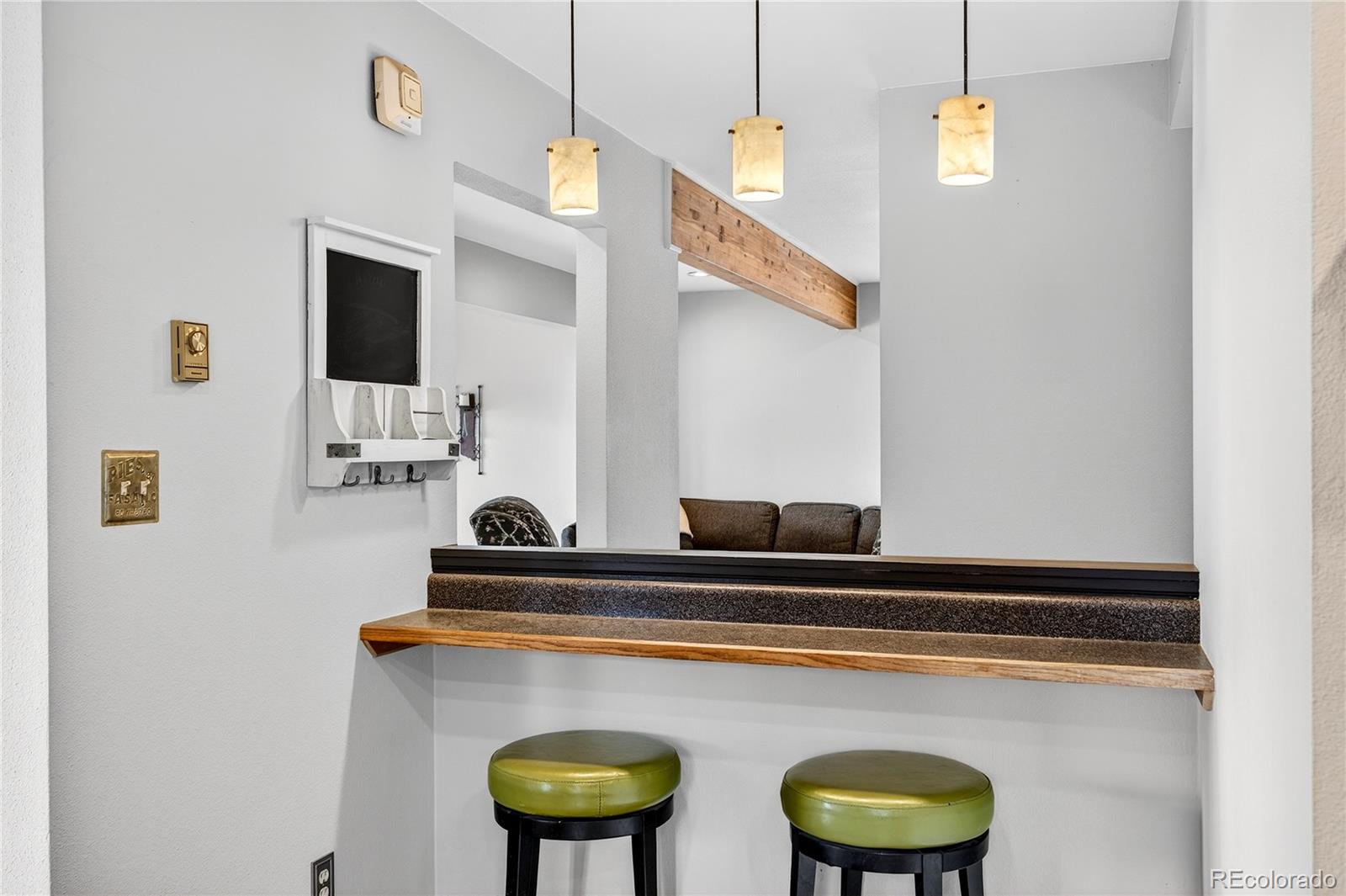 31249 Robinson Hill Road Golden, CO 80403 - Photo 14 of 48 a kitchen with a stove and a refrigerator