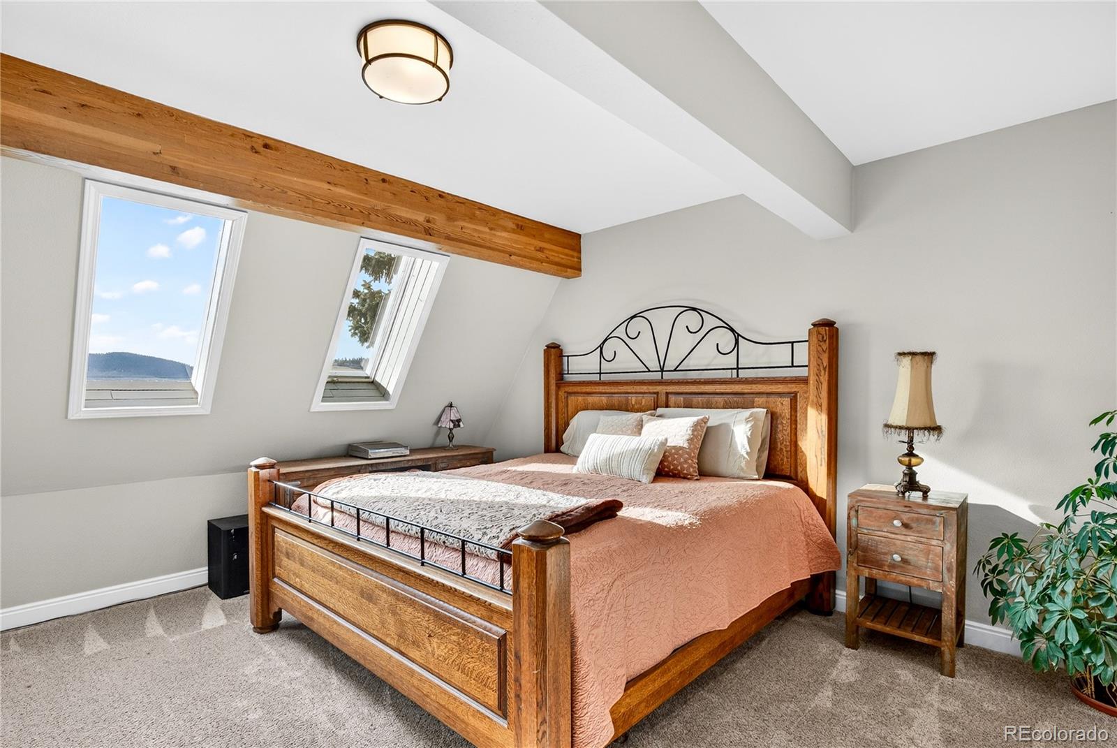 31249 Robinson Hill Road Golden, CO 80403 - Photo 20 of 48 a bedroom with a bed and window