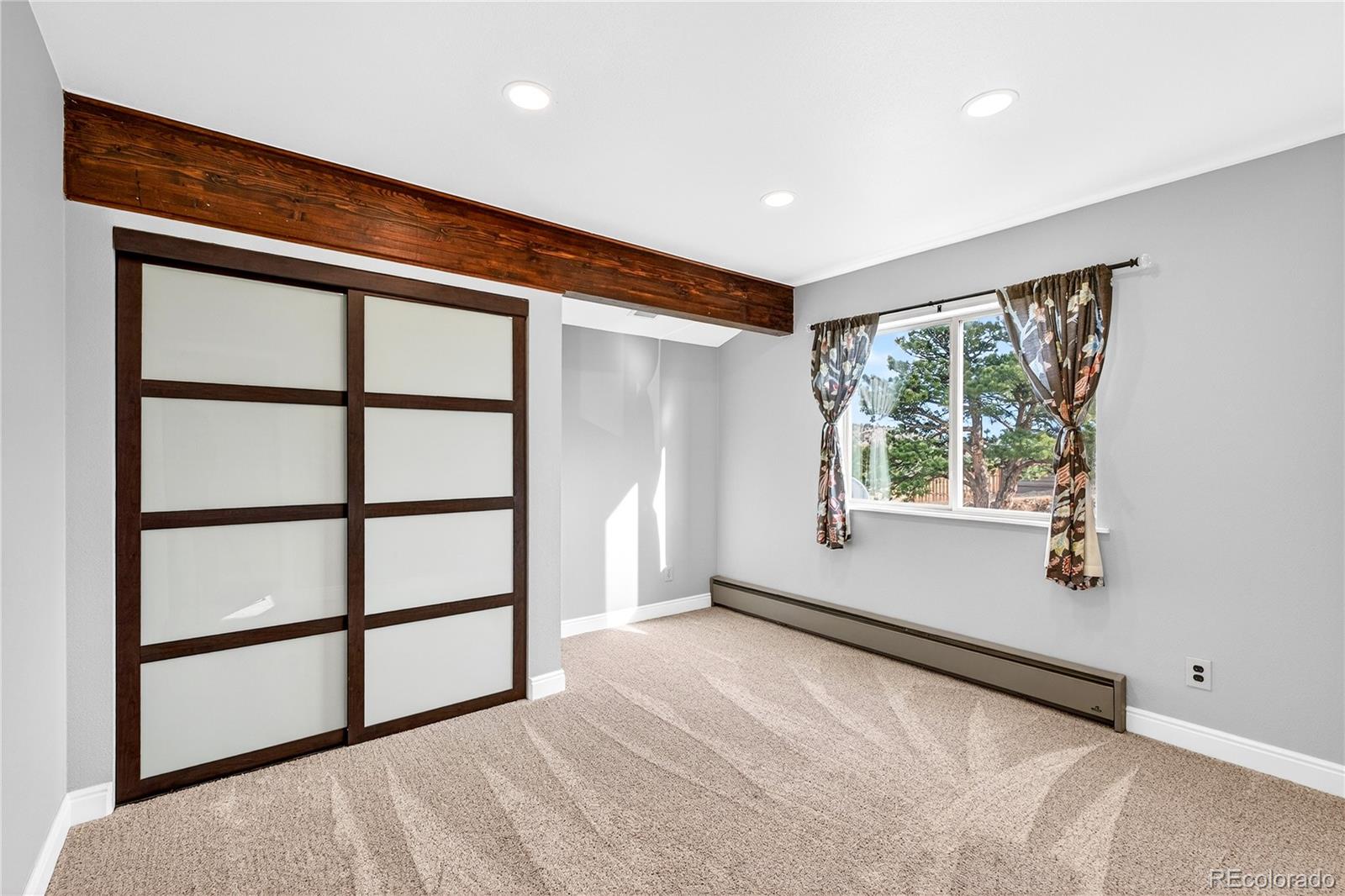 31249 Robinson Hill Road Golden, CO 80403 - Photo 24 of 48 a view of an empty room with a window