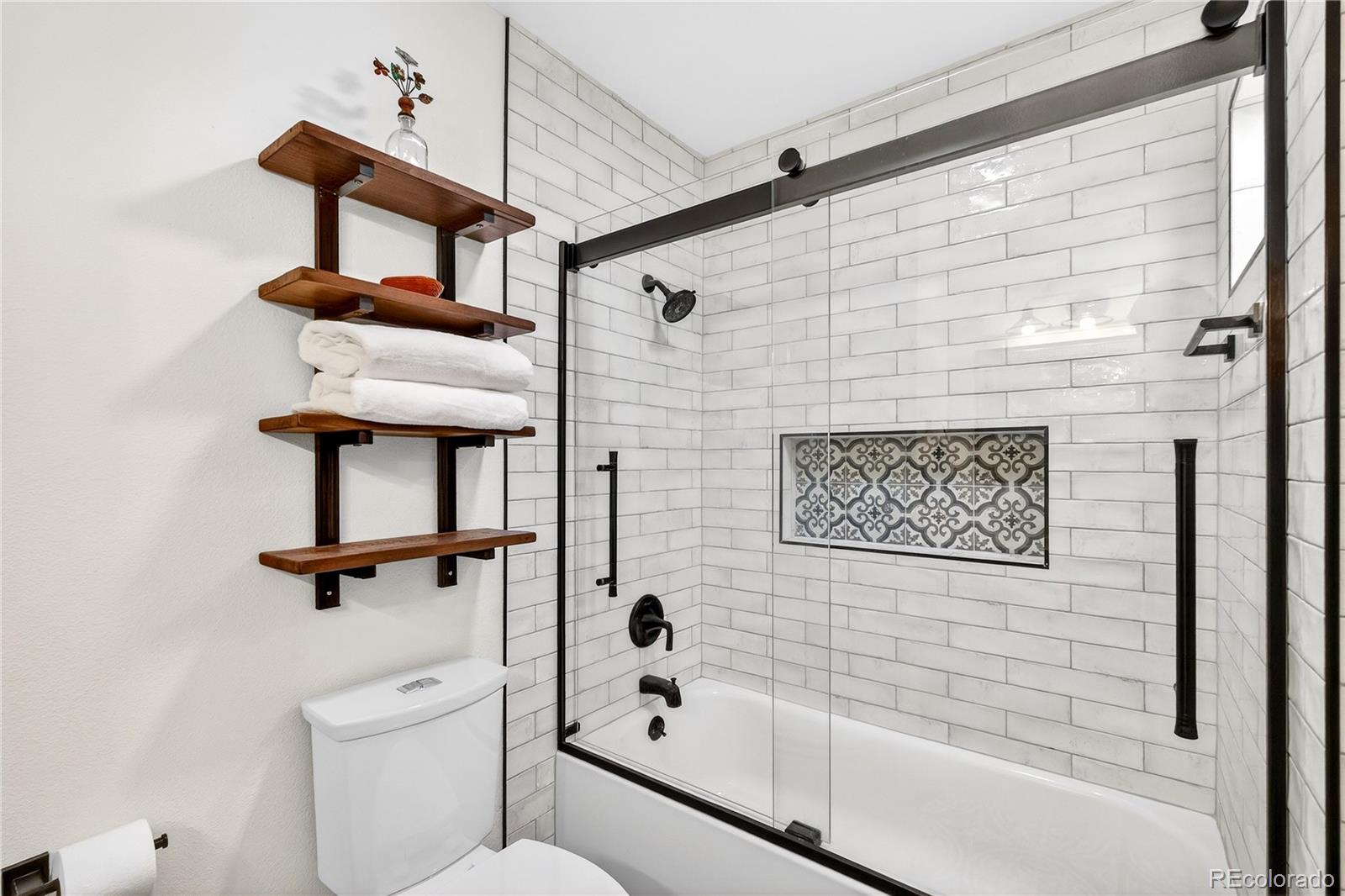 31249 Robinson Hill Road Golden, CO 80403 - Photo 26 of 48 a bathroom with a shower a sink and mirror