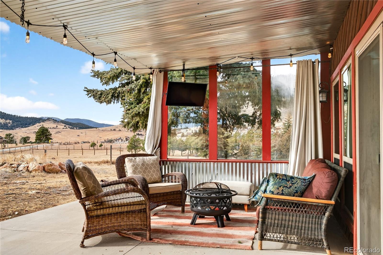 31249 Robinson Hill Road Golden, CO 80403 - Photo 32 of 48 a view of a chairs and table in the balcony