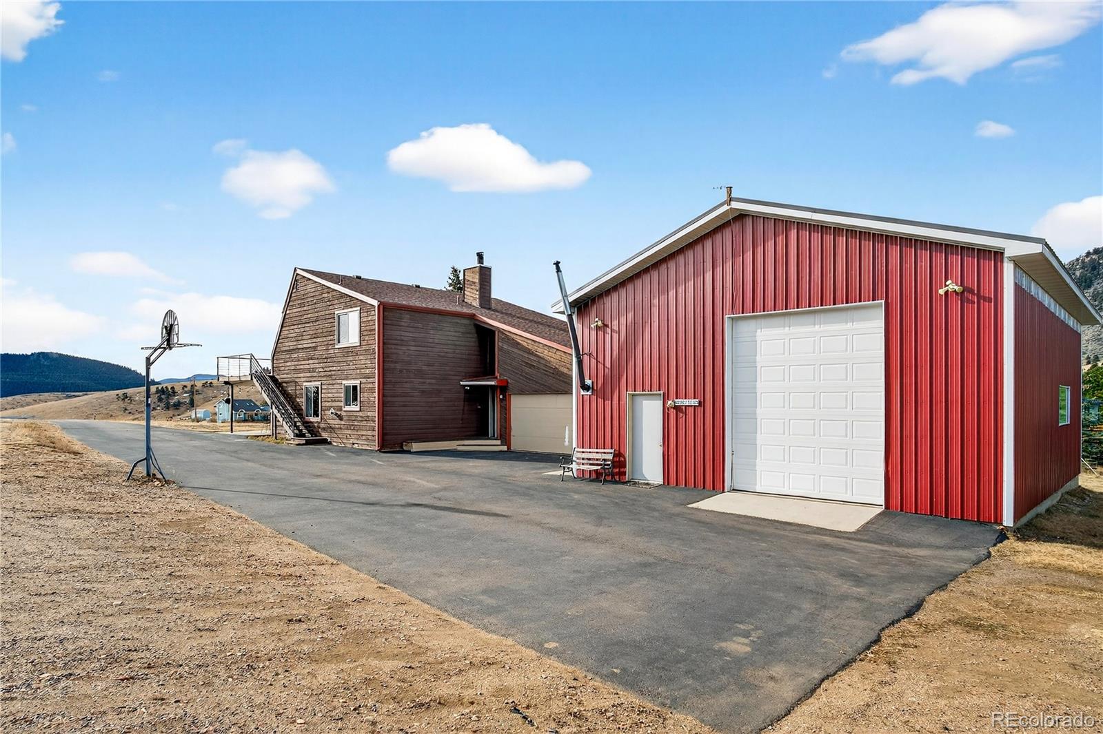 31249 Robinson Hill Road Golden, CO 80403 - Photo 34 of 48 a front view of a house with a garage