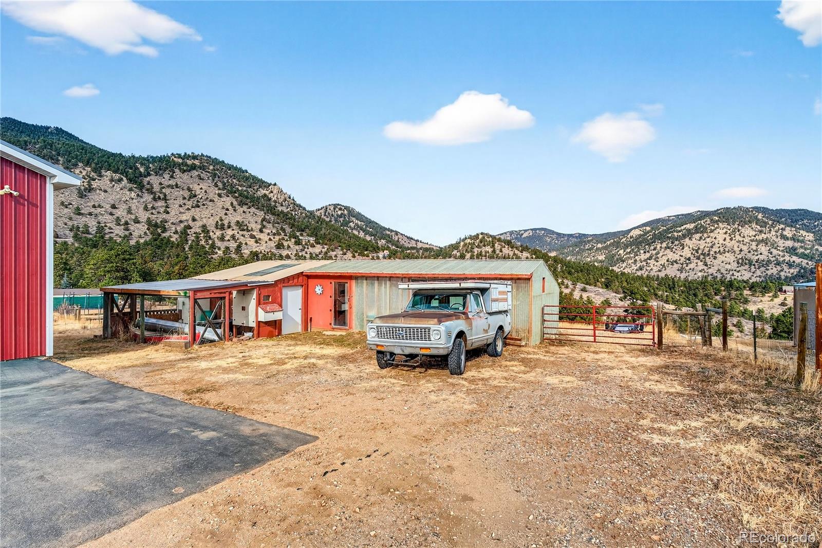 31249 Robinson Hill Road Golden, CO 80403 - Photo 37 of 48 a view of a house with a yard and sitting area
