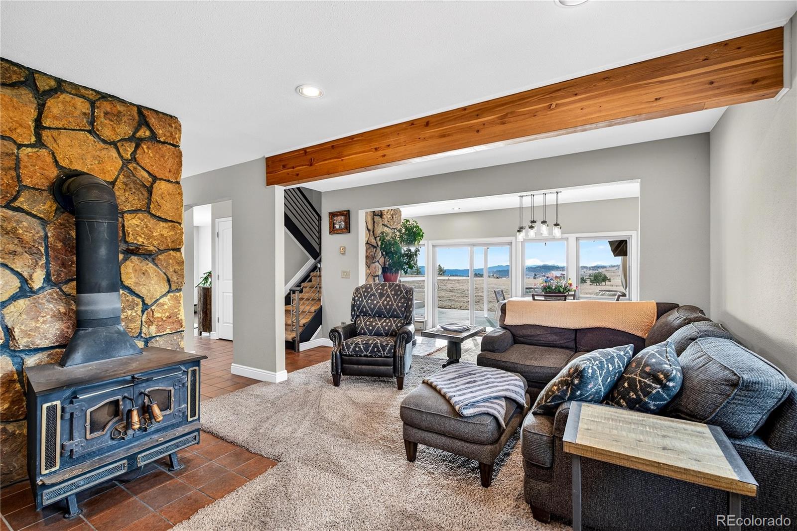 31249 Robinson Hill Road Golden, CO 80403 - Photo 8 of 48 a living room with furniture and a book shelf