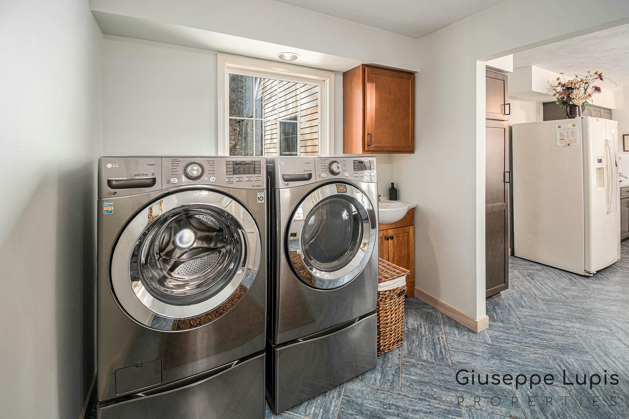 309 Stickney Ridge Road Grand Haven, MI 49417 - Photo 13 of 62 main floor laundry