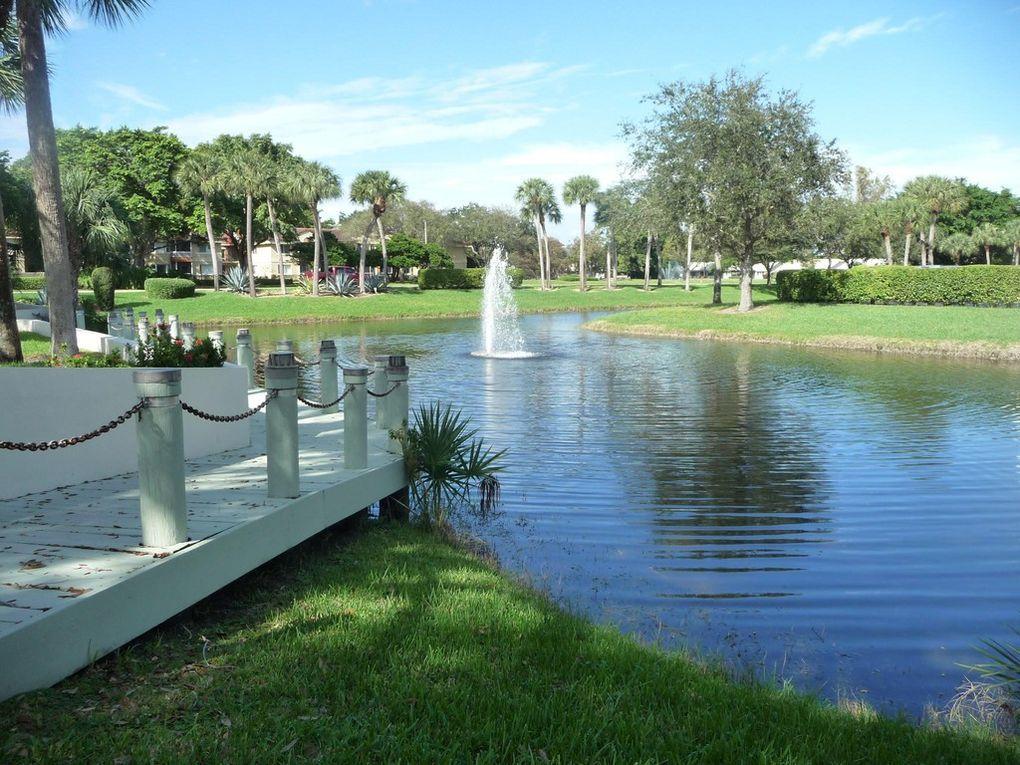 5901 Camino Del Sol, Unit 203 Boca Raton, FL 33433 - Photo 12 of 15 dock and lake