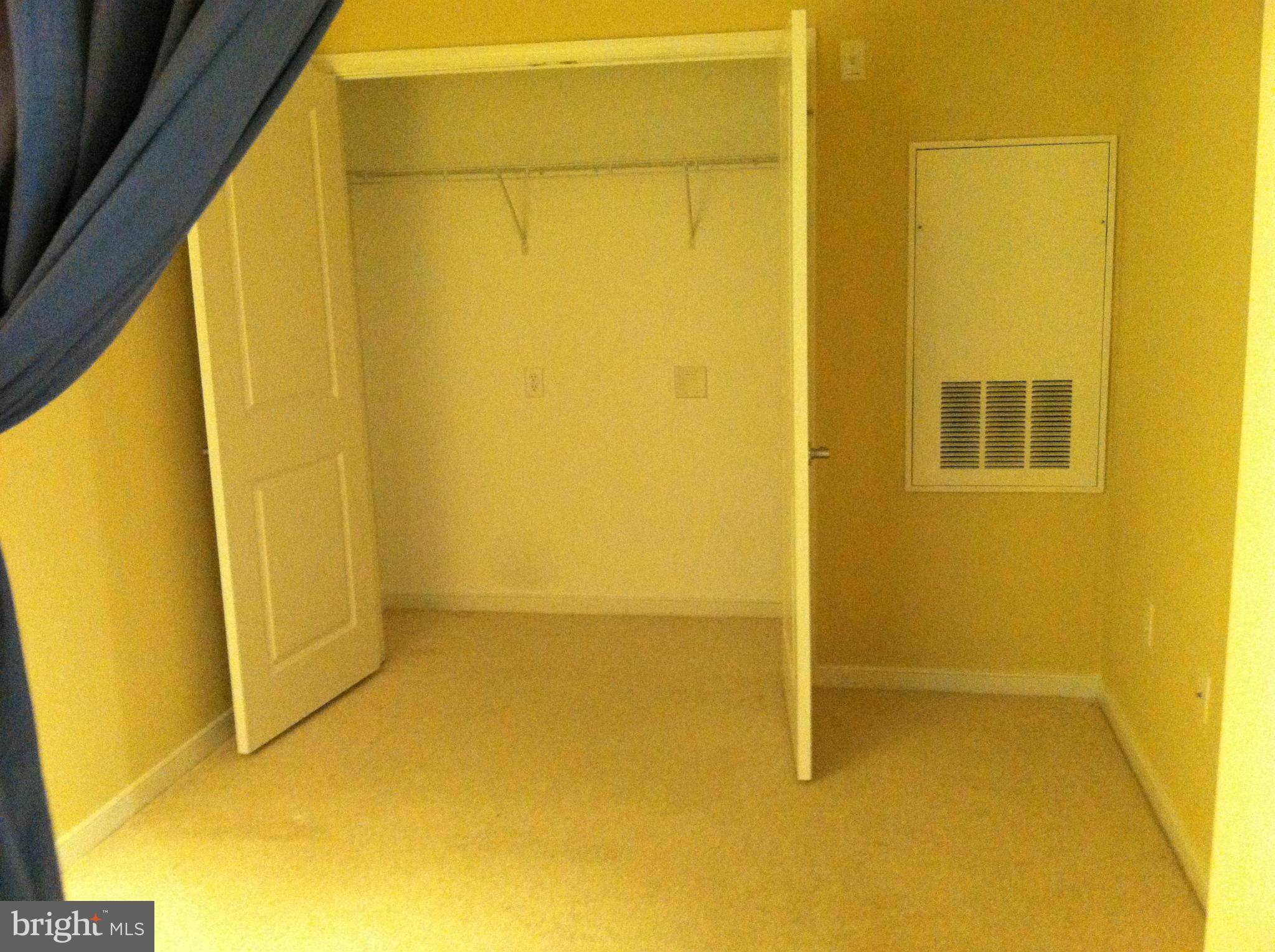 8045 Newell Street, Unit 203 Silver Spring, MD 20910 - Photo 8 of 11 a view of an empty room with windows
