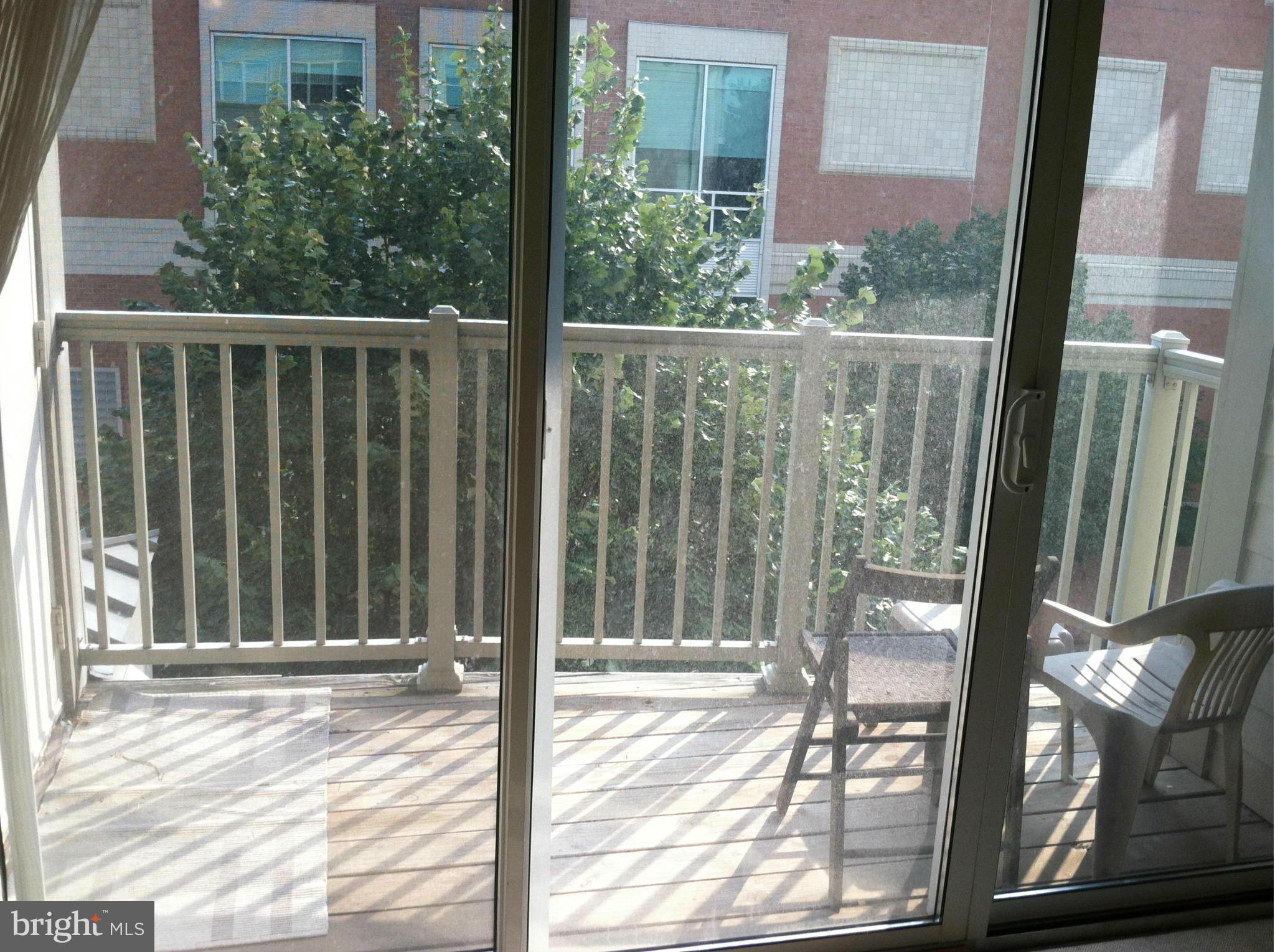 8045 Newell Street, Unit 203 Silver Spring, MD 20910 - Photo 10 of 11 a view of a balcony with a door