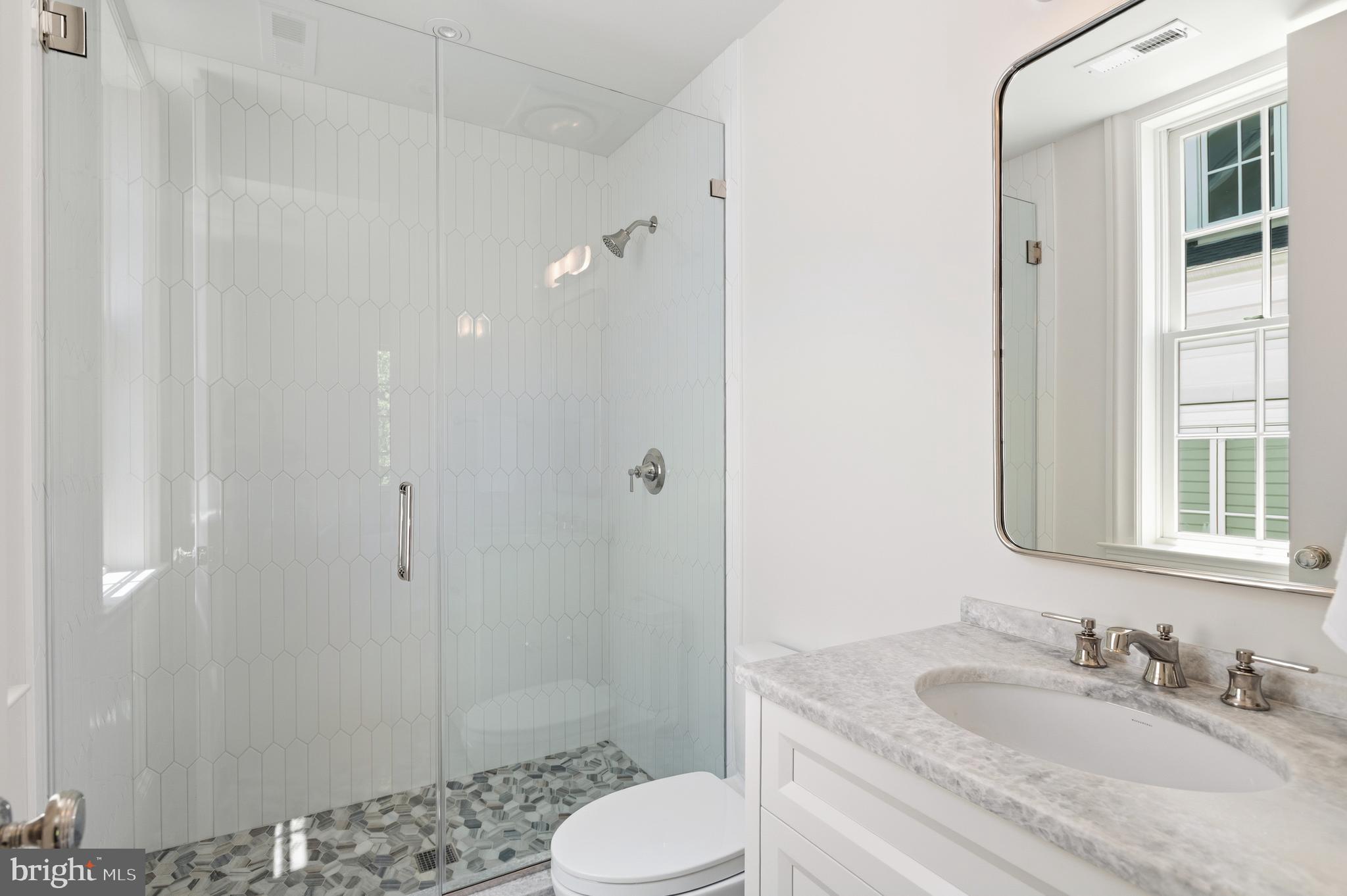 2604 36th Street Northwest Washington, DC 20007 - Photo 20 of 38 a bathroom with a sink toilet and shower