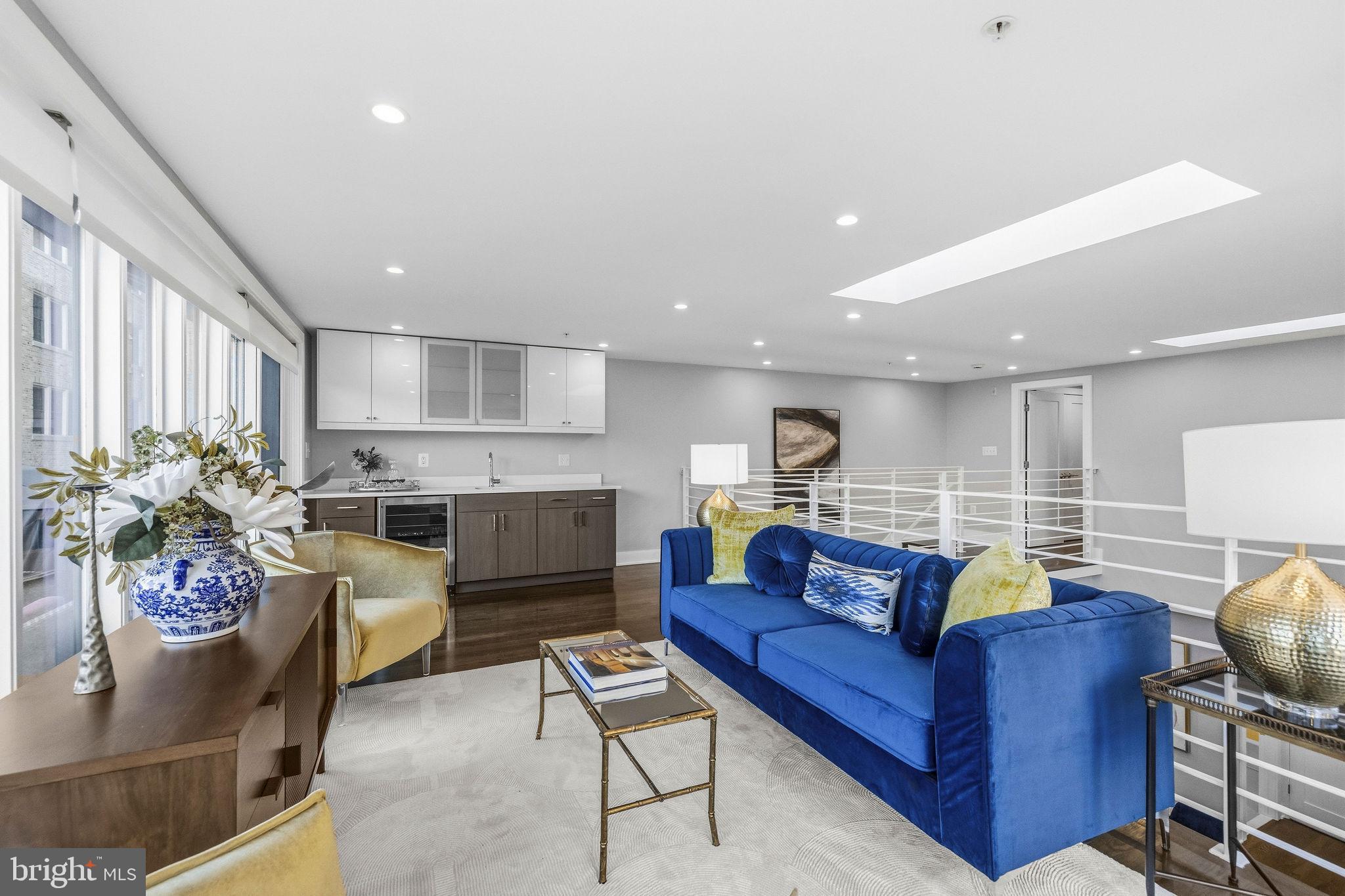 2012 Kalorama Road Northwest, Unit 8 Washington, DC 20009 - Photo 19 of 25 a living room with furniture kitchen view and a potted plant