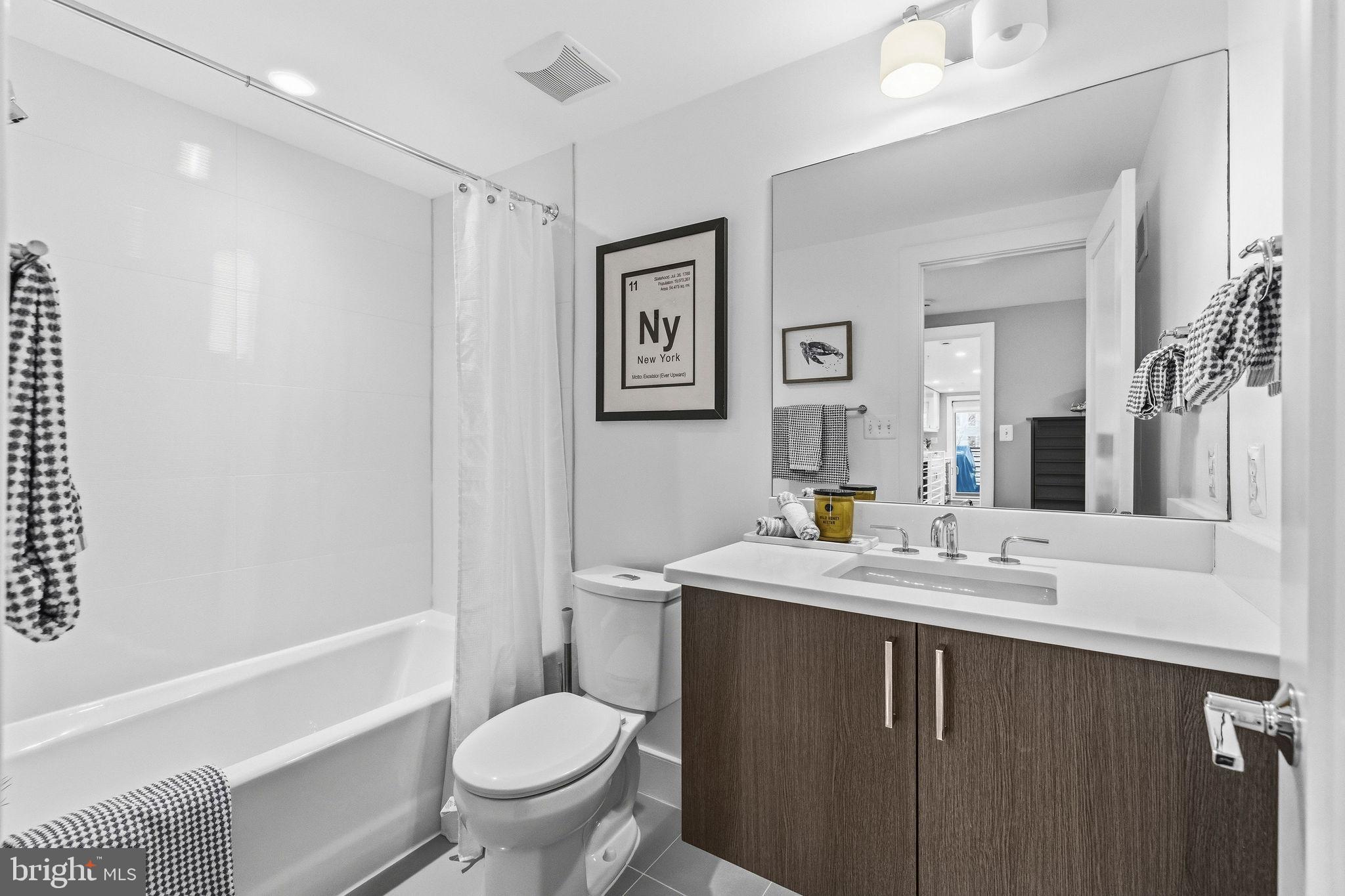 2012 Kalorama Road Northwest, Unit 8 Washington, DC 20009 - Photo 22 of 25 a bathroom with a sink toilet and a mirror