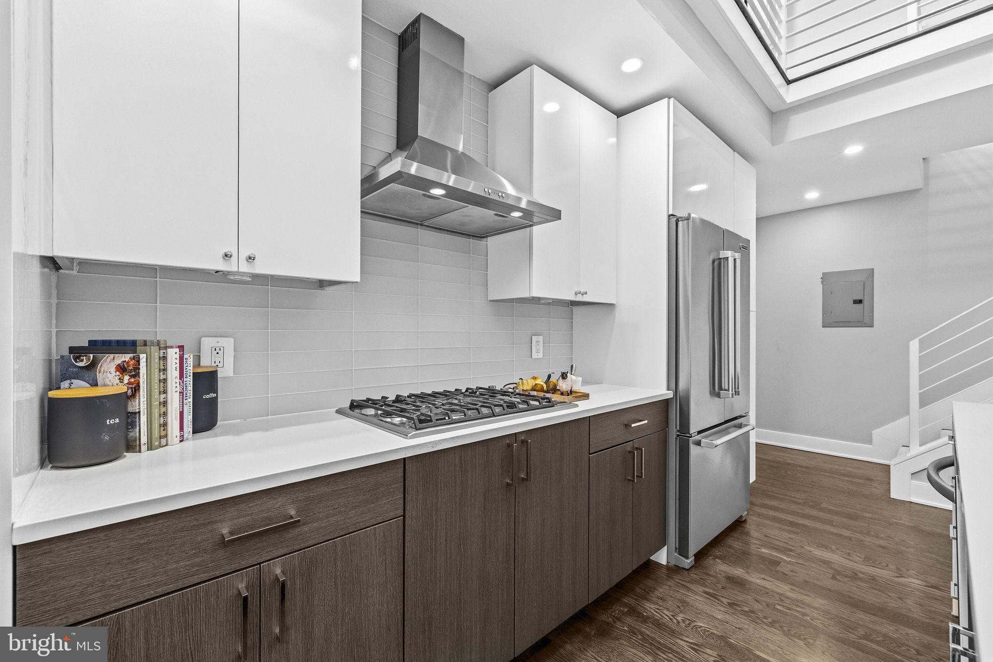 2012 Kalorama Road Northwest, Unit 8 Washington, DC 20009 - Photo 5 of 25 a kitchen with stainless steel appliances a sink a stove and cabinets