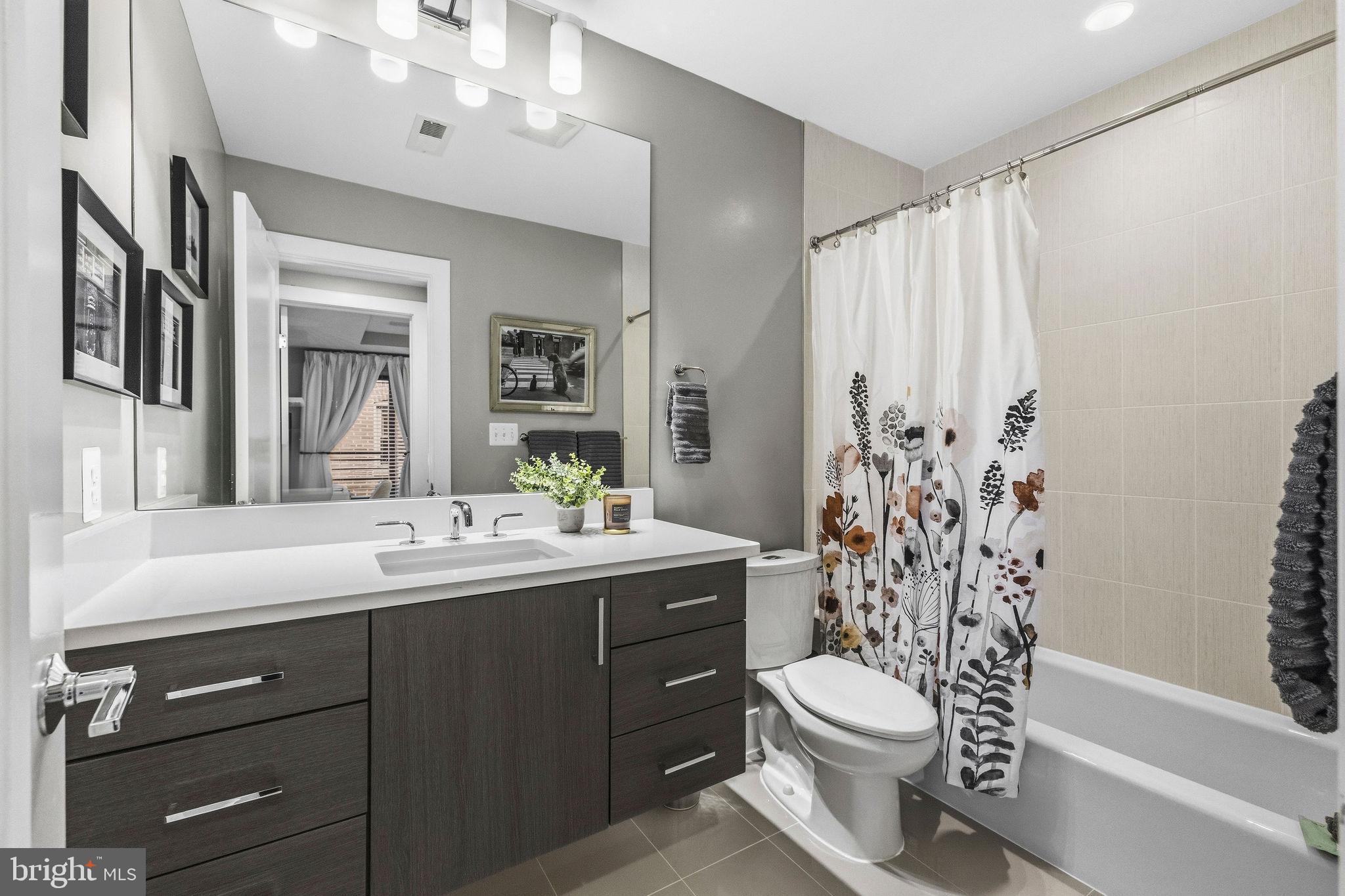 2012 Kalorama Road Northwest, Unit 8 Washington, DC 20009 - Photo 6 of 25 a bathroom with a sink a toilet and shower
