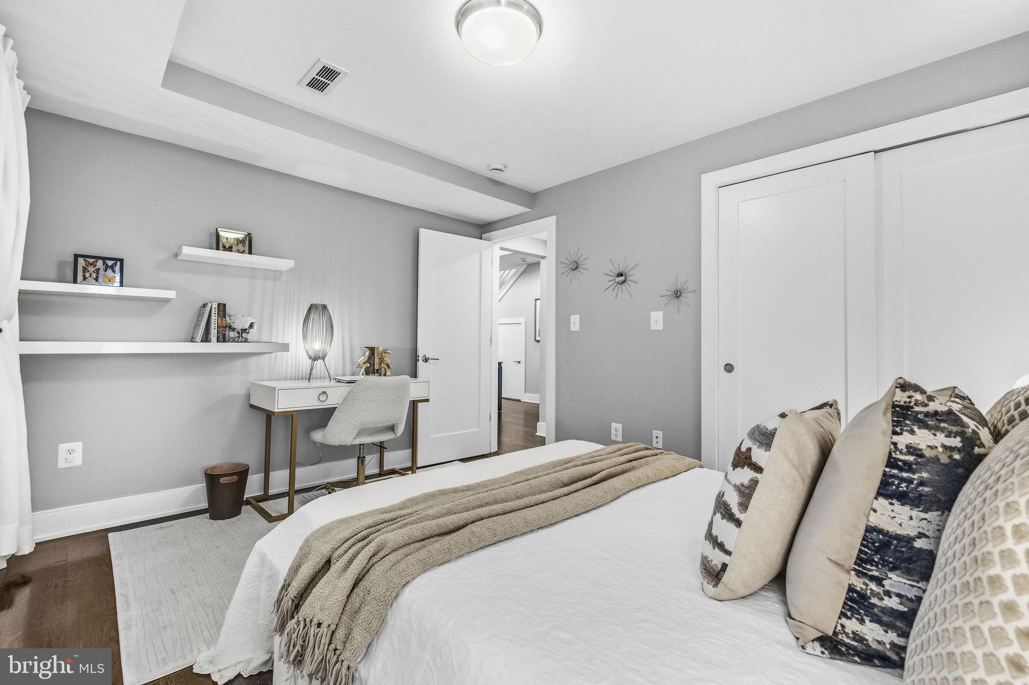 2012 Kalorama Road Northwest, Unit 8 Washington, DC 20009 - Photo 7 of 25 a bedroom with bed and a night stand