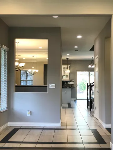 a view of kitchen with dining area and windows