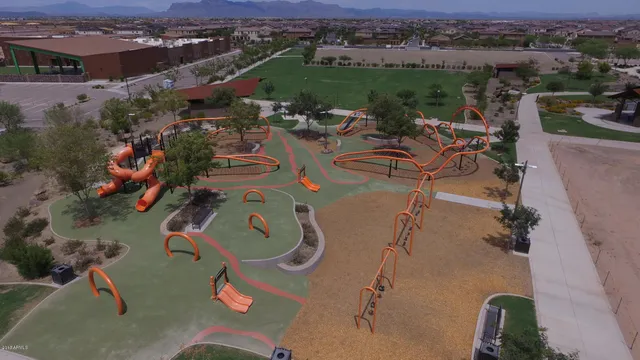 an aerial view of a swimming pool with mountain view