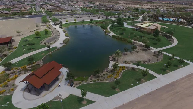 an aerial view of a house with a lake view