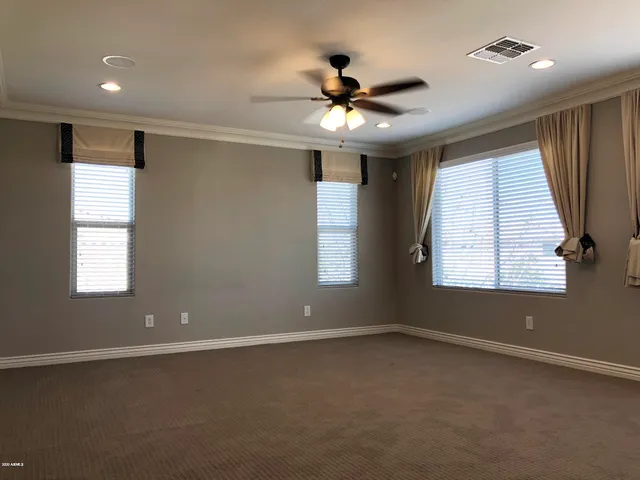 a spacious bathroom with a bathtub a sink a mirror and a shower