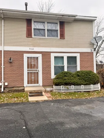 a view of a house with a garden
