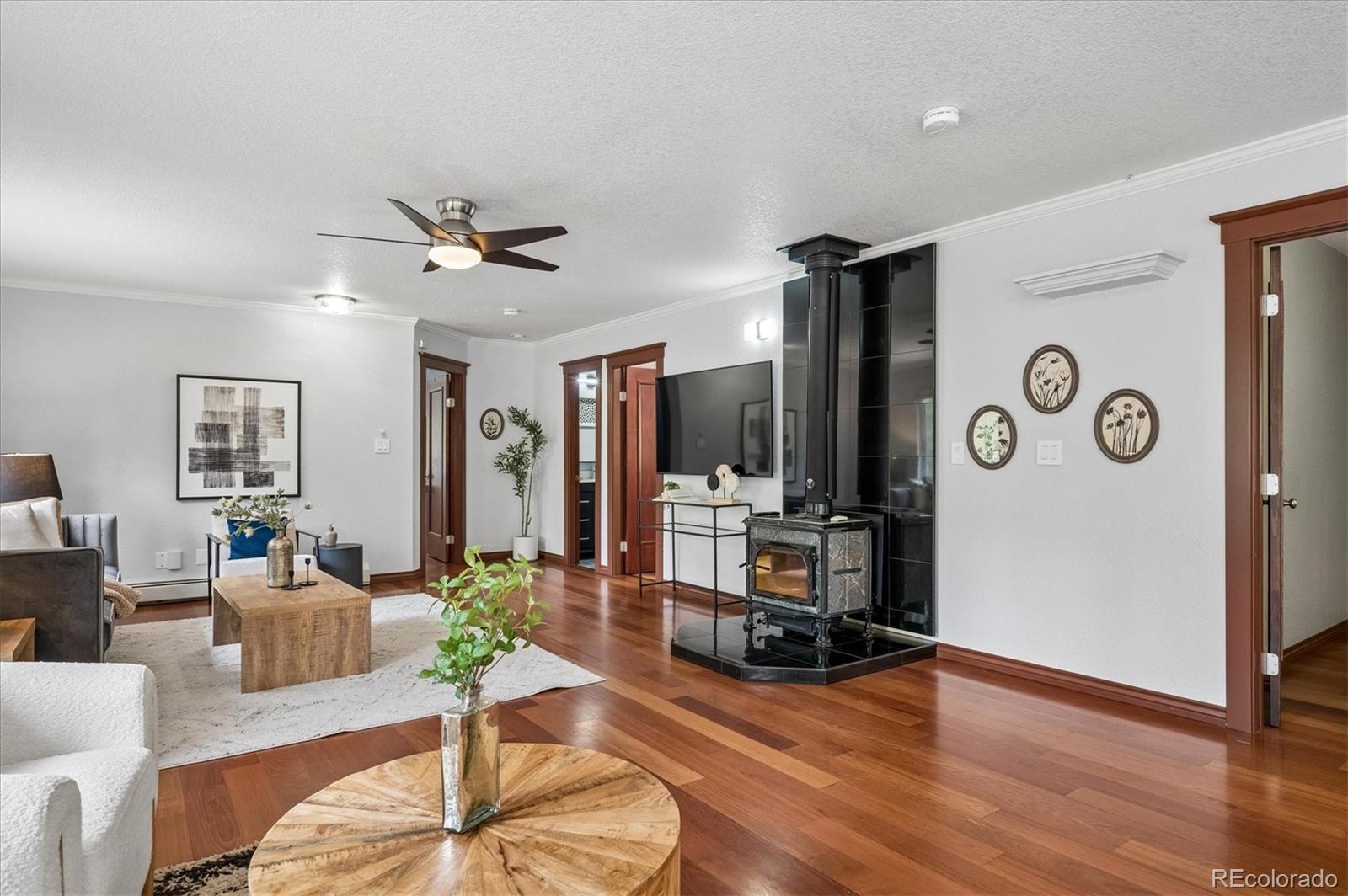 6747 South Brook Forest Road Evergreen, CO 80439 - Photo 15 of 49 a living room with furniture and wooden floor