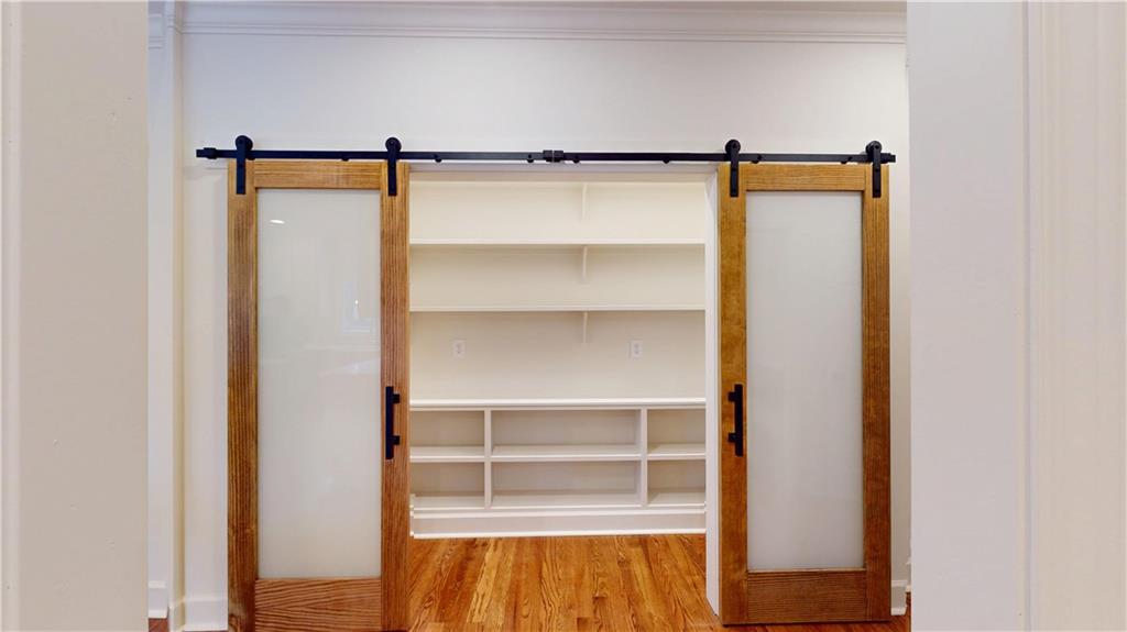 66 Highland Drive Jefferson, GA 30549 - Photo 16 of 63 a view of walk in closet with empty racks