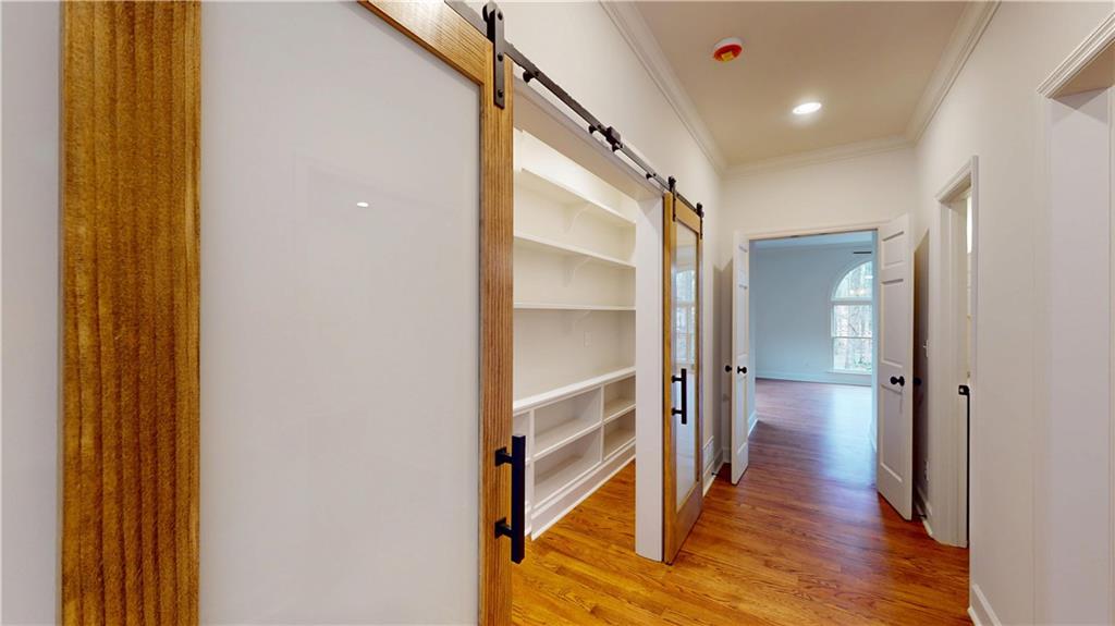 66 Highland Drive Jefferson, GA 30549 - Photo 17 of 63 a view of a hallway with wooden floor and staircase