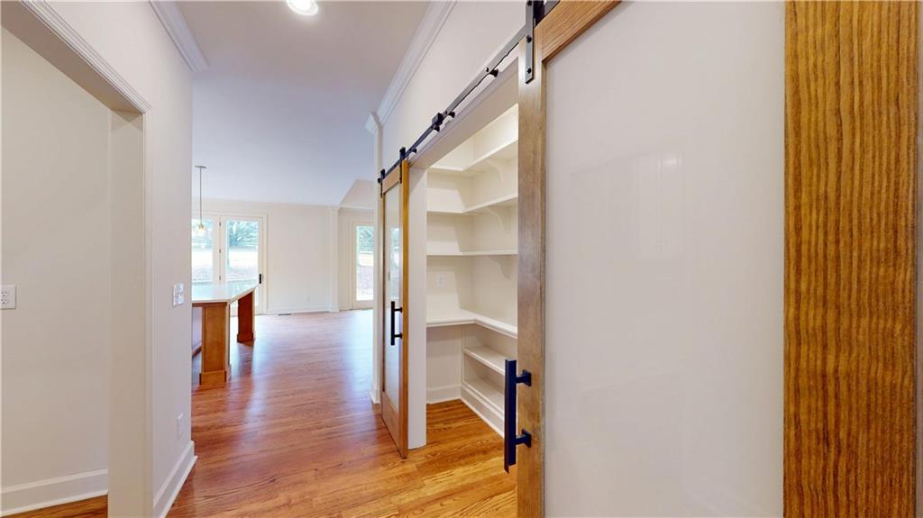 66 Highland Drive Jefferson, GA 30549 - Photo 20 of 63 a view of a hallway view with wooden floor and staircase
