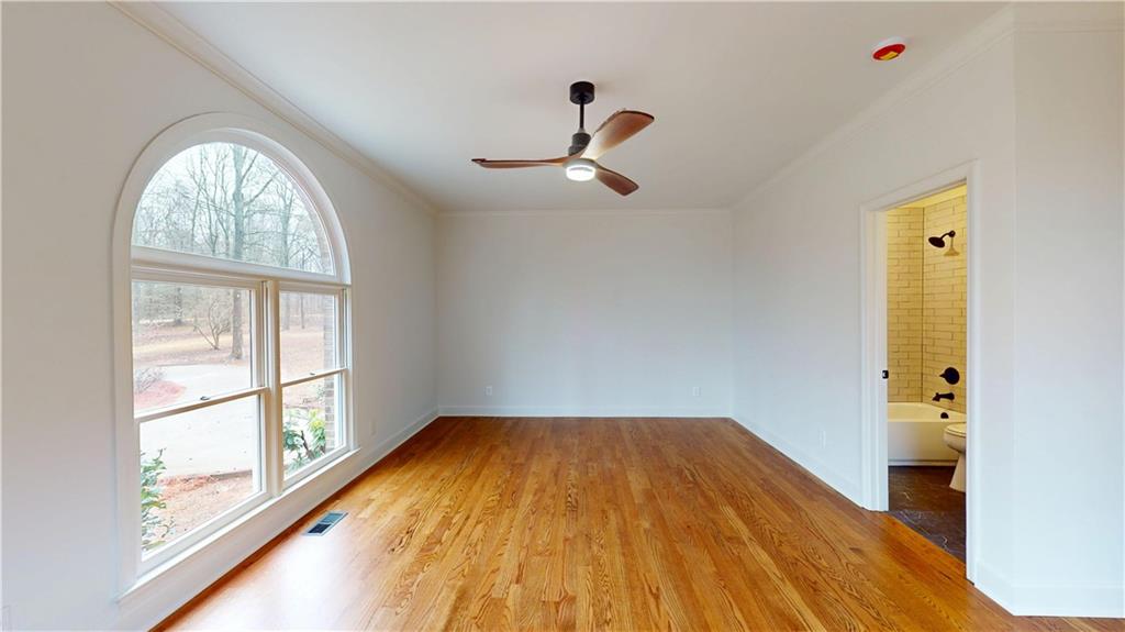 66 Highland Drive Jefferson, GA 30549 - Photo 25 of 63 a view of empty room with wooden floor and fan