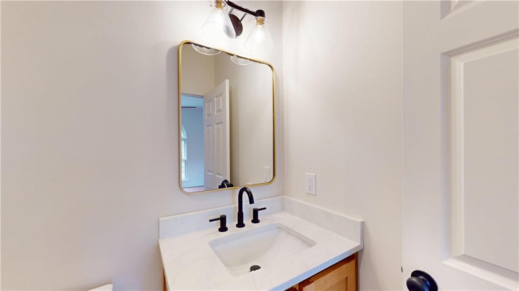 66 Highland Drive Jefferson, GA 30549 - Photo 27 of 63 a bathroom with a sink and a mirror