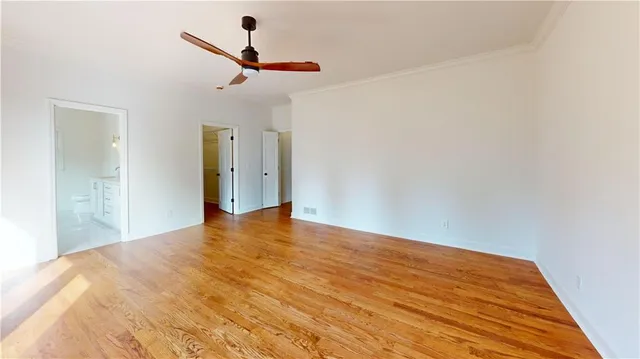 a bathroom with a double vanity sink toilet and shower