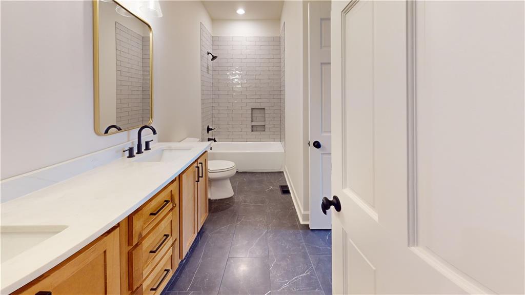 66 Highland Drive Jefferson, GA 30549 - Photo 41 of 63 a bathroom with a double vanity sink toilet and shower