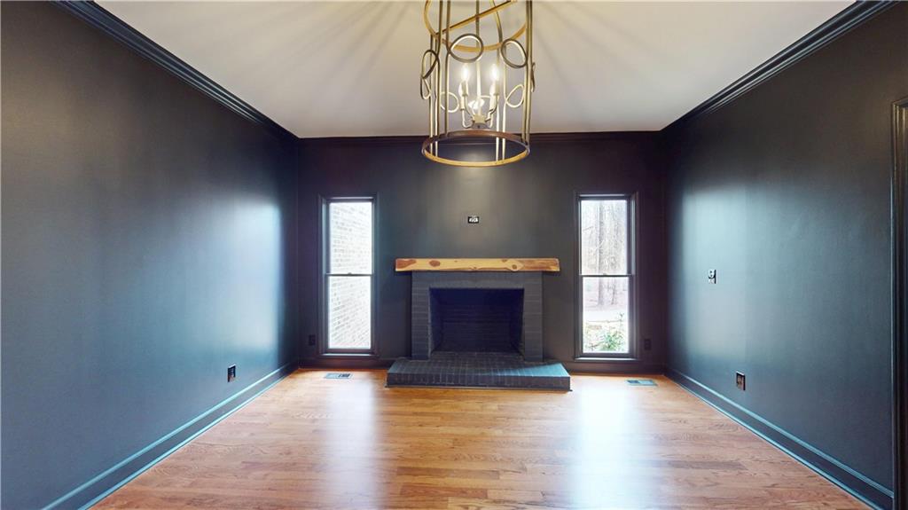 66 Highland Drive Jefferson, GA 30549 - Photo 49 of 63 a view of an empty room with window and wooden floor