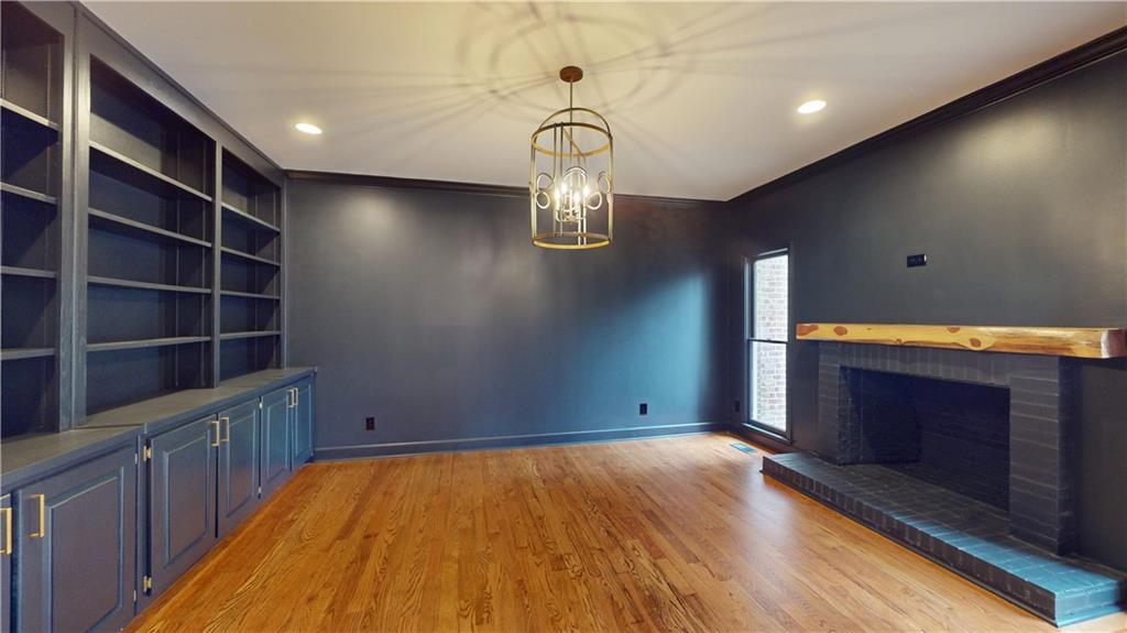 66 Highland Drive Jefferson, GA 30549 - Photo 51 of 63 a room with hard wood floors and a fireplace