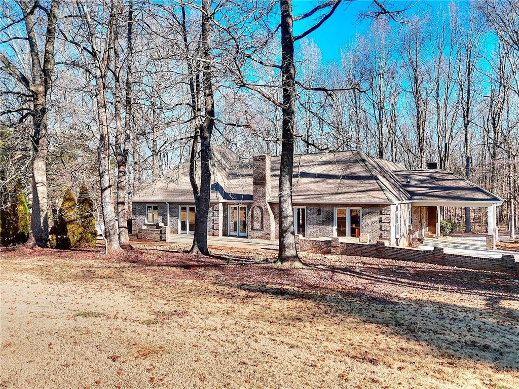 66 Highland Drive Jefferson, GA 30549 - Photo 55 of 63 a front view of a house with a yard