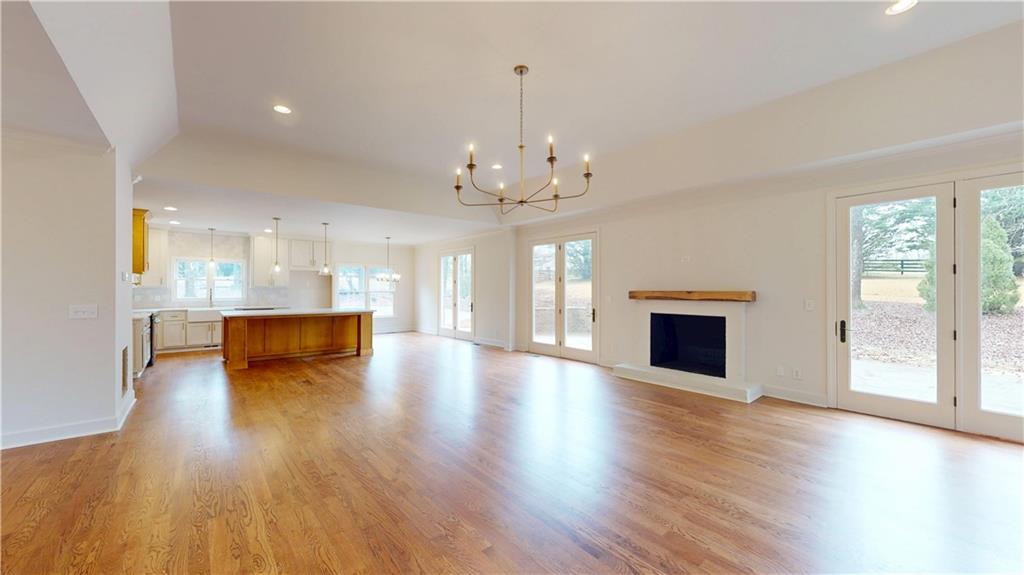 66 Highland Drive Jefferson, GA 30549 - Photo 7 of 63 a view of a room with wooden floor and a fireplace