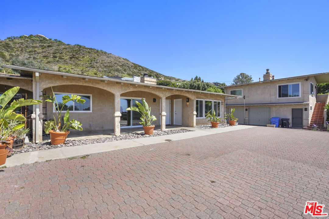 31259 Bailard Road Malibu, CA 90265 - Photo 31 of 43 a view of a house with a patio