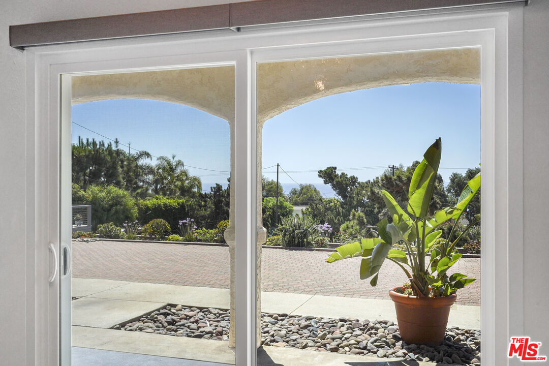 31259 Bailard Road Malibu, CA 90265 - Photo 4 of 43 a view of a glass door with a chair