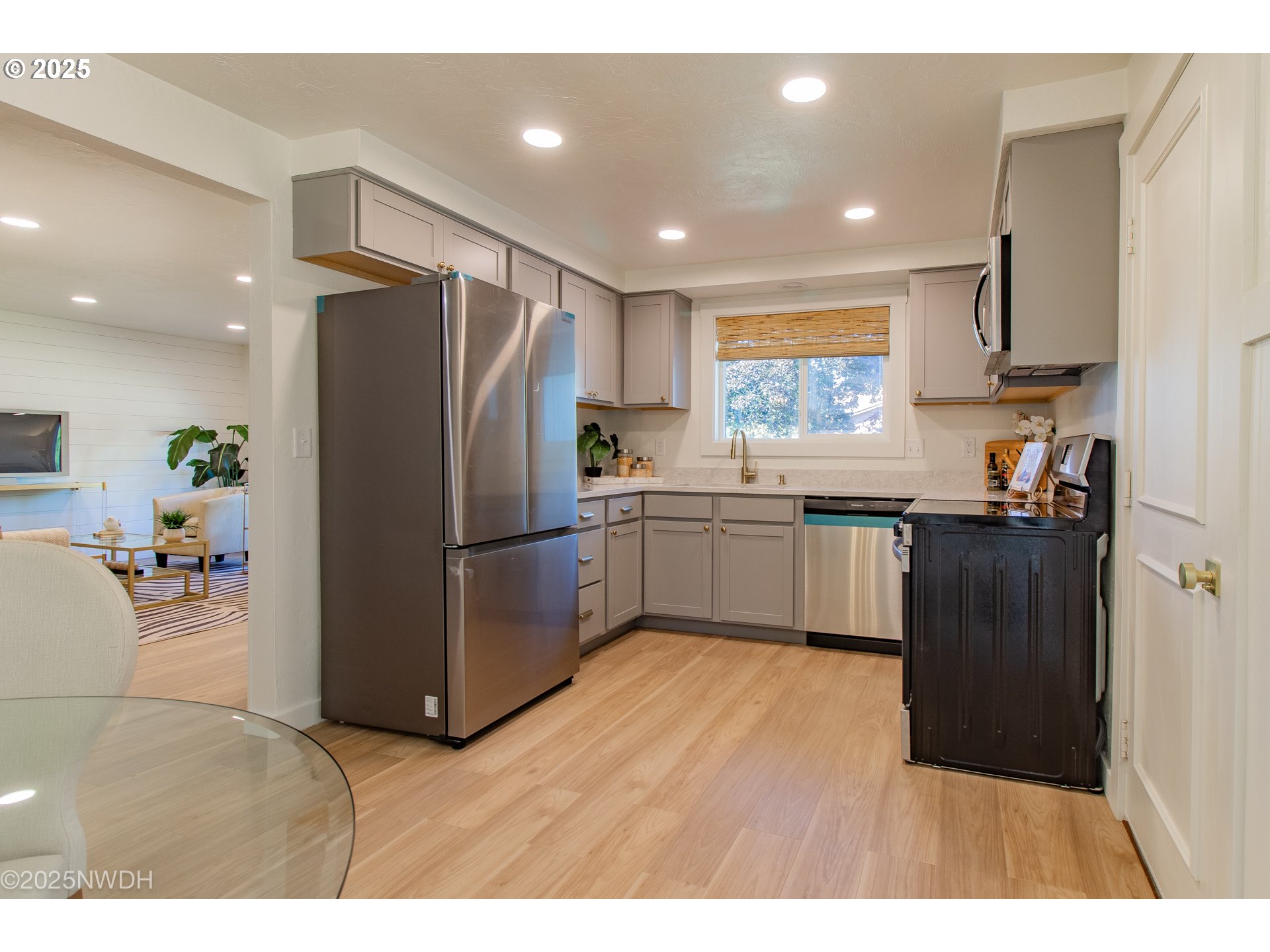 651 T Street Springfield, OR 97477 - Photo 11 of 32 a kitchen with refrigerator cabinets and furniture