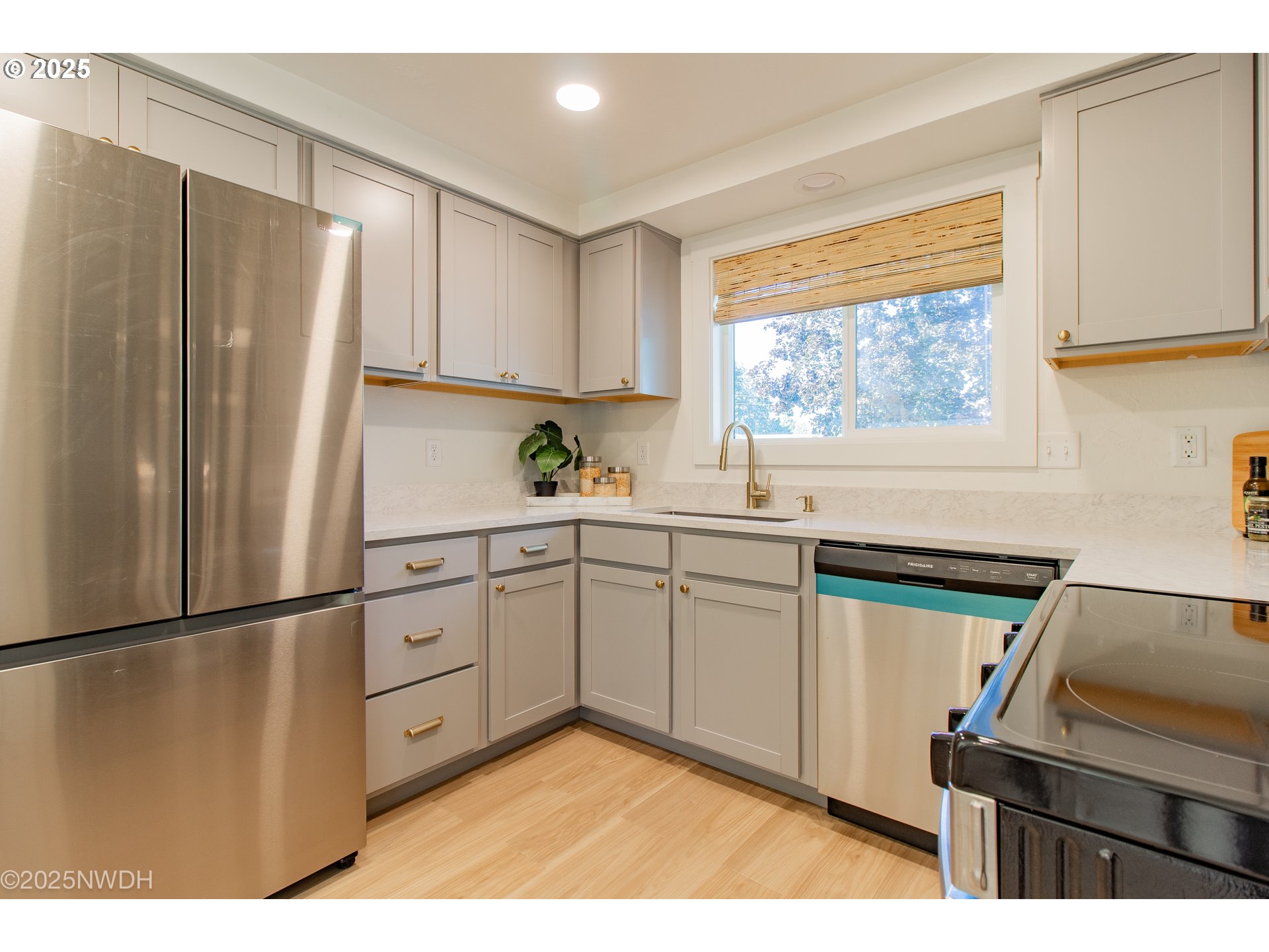 651 T Street Springfield, OR 97477 - Photo 12 of 32 a kitchen with a refrigerator and a sink