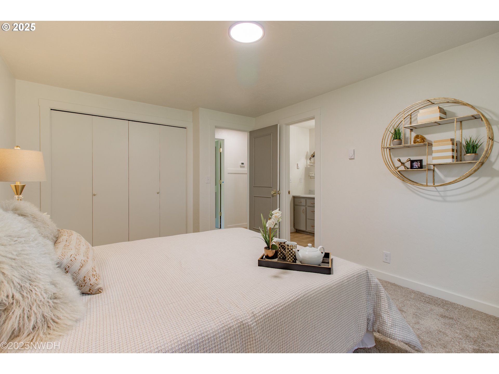 651 T Street Springfield, OR 97477 - Photo 17 of 32 a view of a bedroom with a bed and a lamp on table