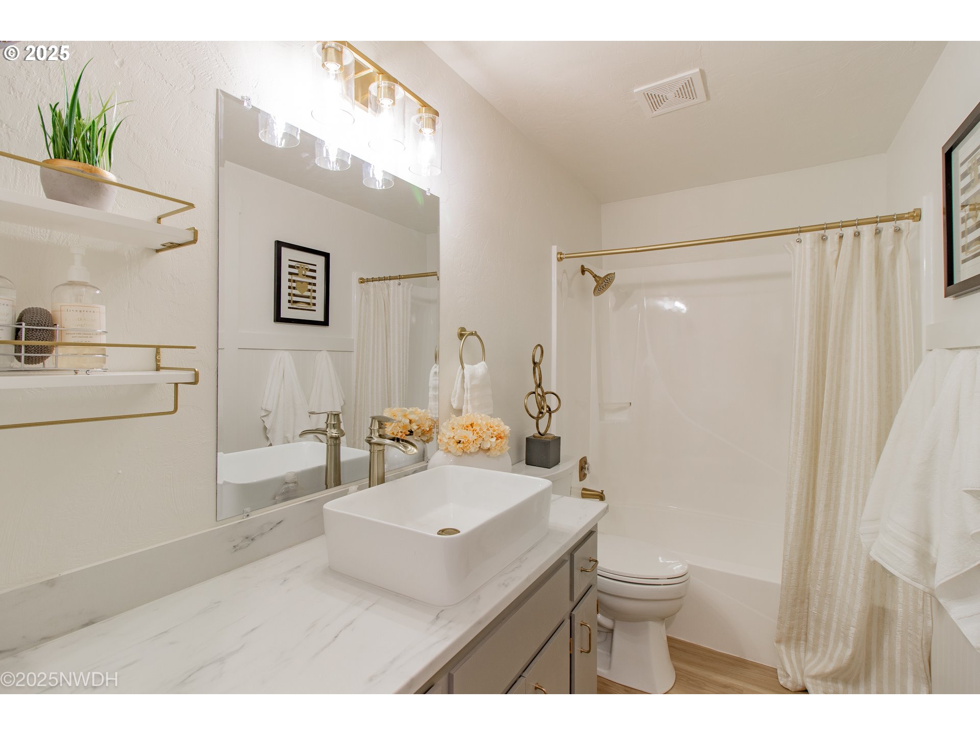 651 T Street Springfield, OR 97477 - Photo 24 of 32 a bathroom with a sink toilet a mirror and shower