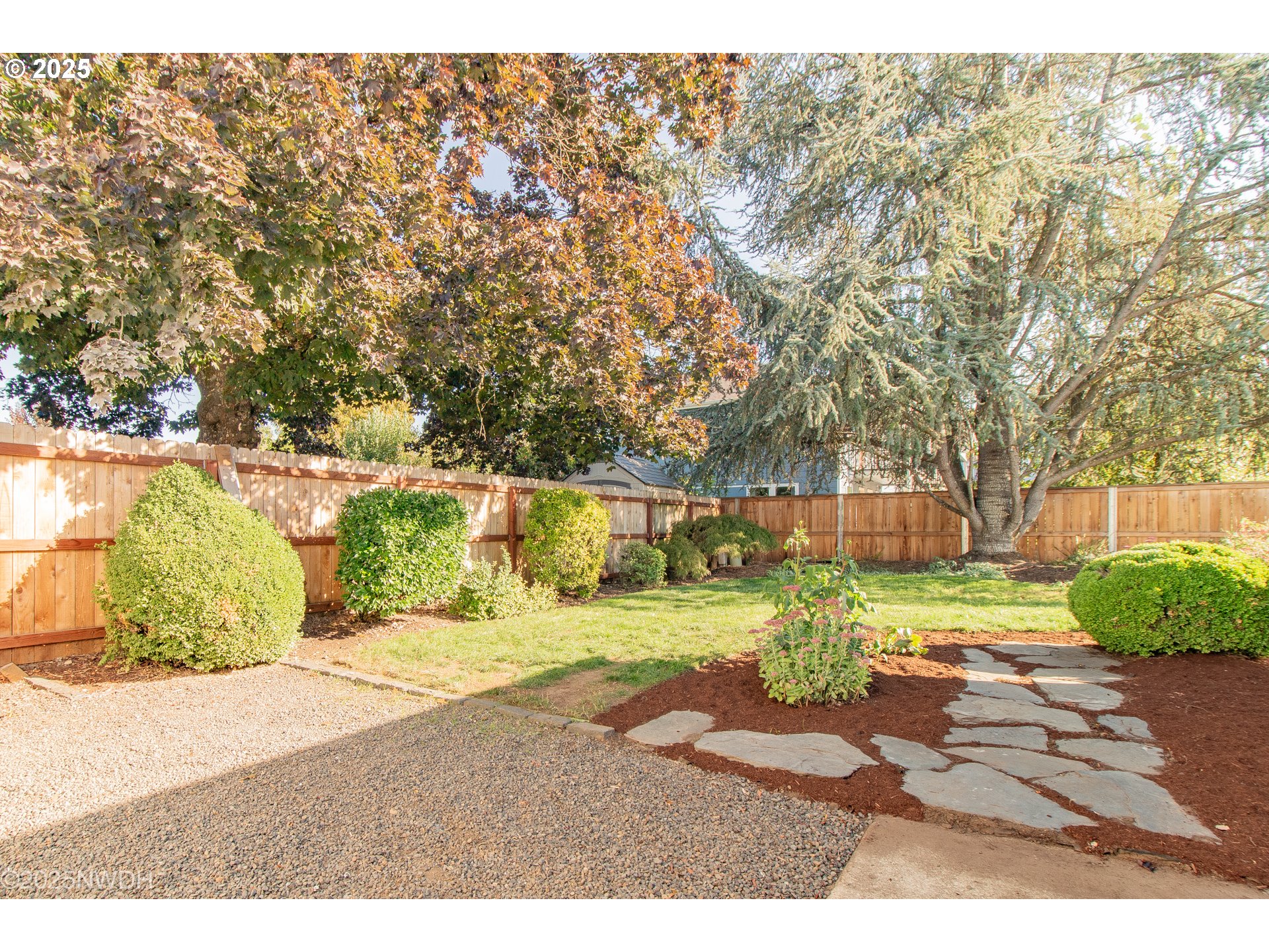651 T Street Springfield, OR 97477 - Photo 26 of 32 a backyard of a house with a yard and outdoor seating