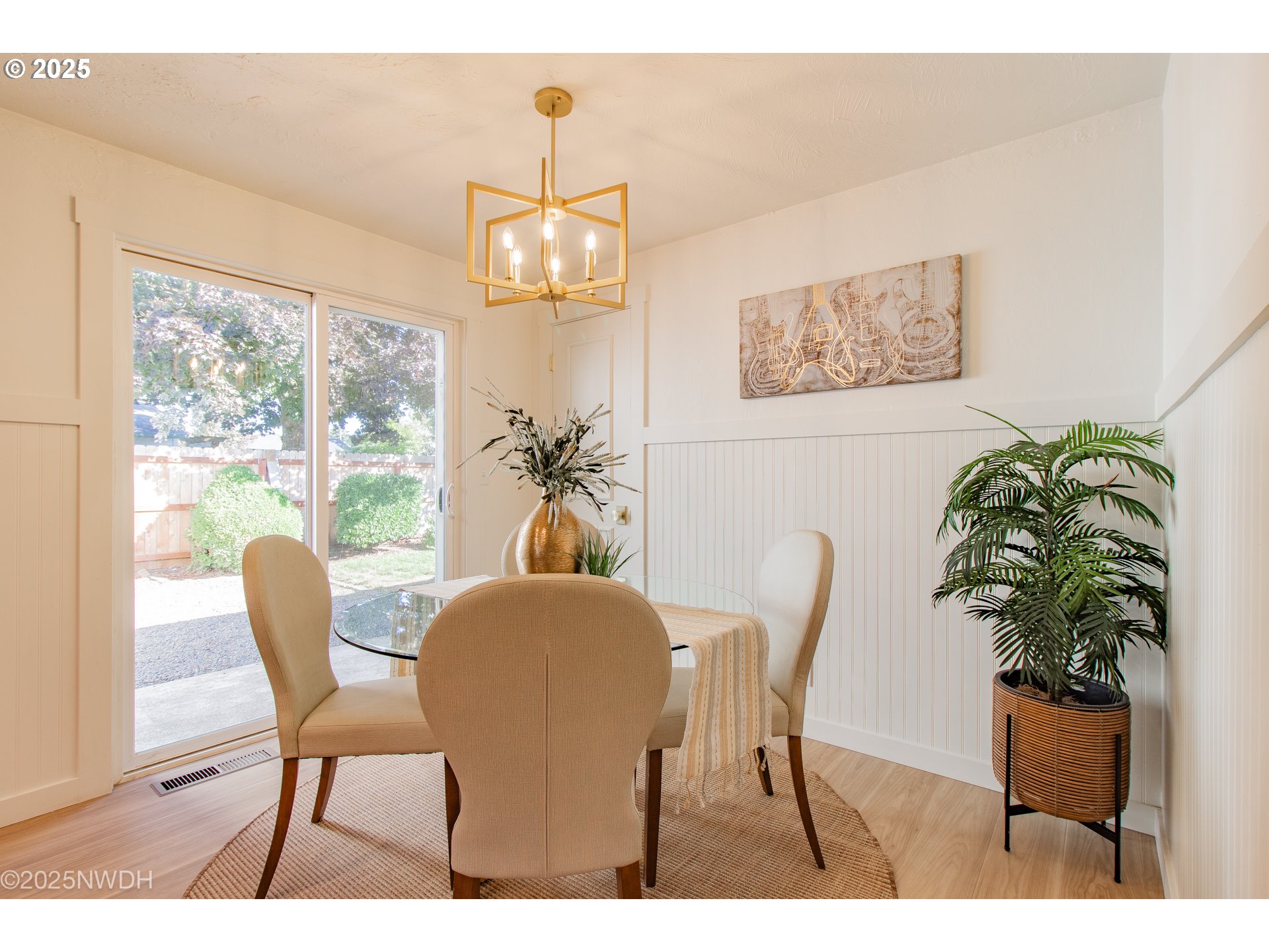 651 T Street Springfield, OR 97477 - Photo 9 of 32 a dining room with furniture potted plants and wooden floor