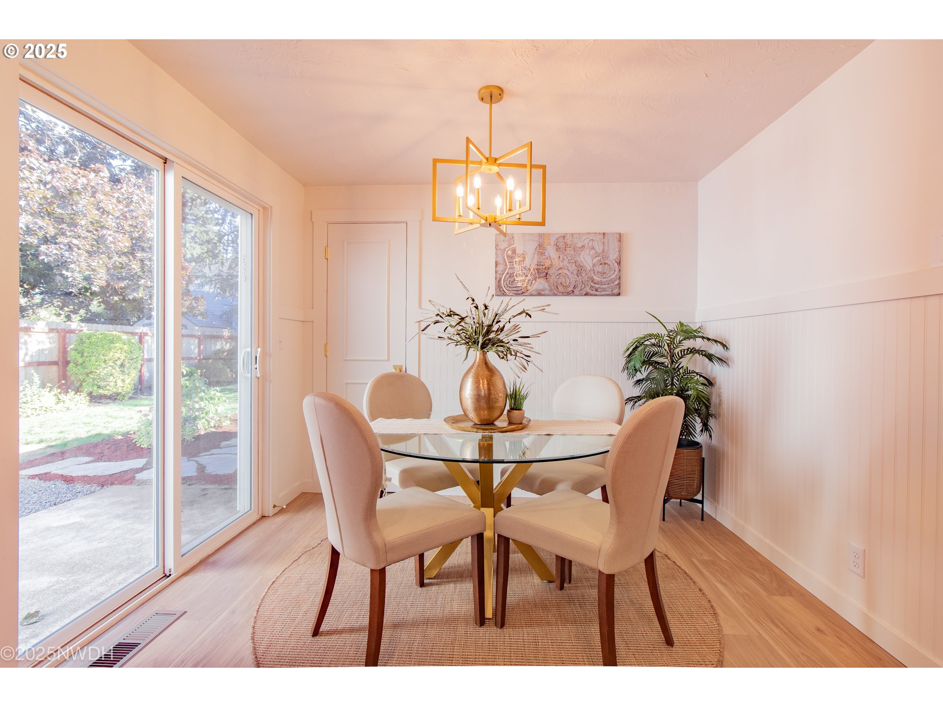 651 T Street Springfield, OR 97477 - Photo 10 of 32 a dining room with furniture a chandelier and wooden floor