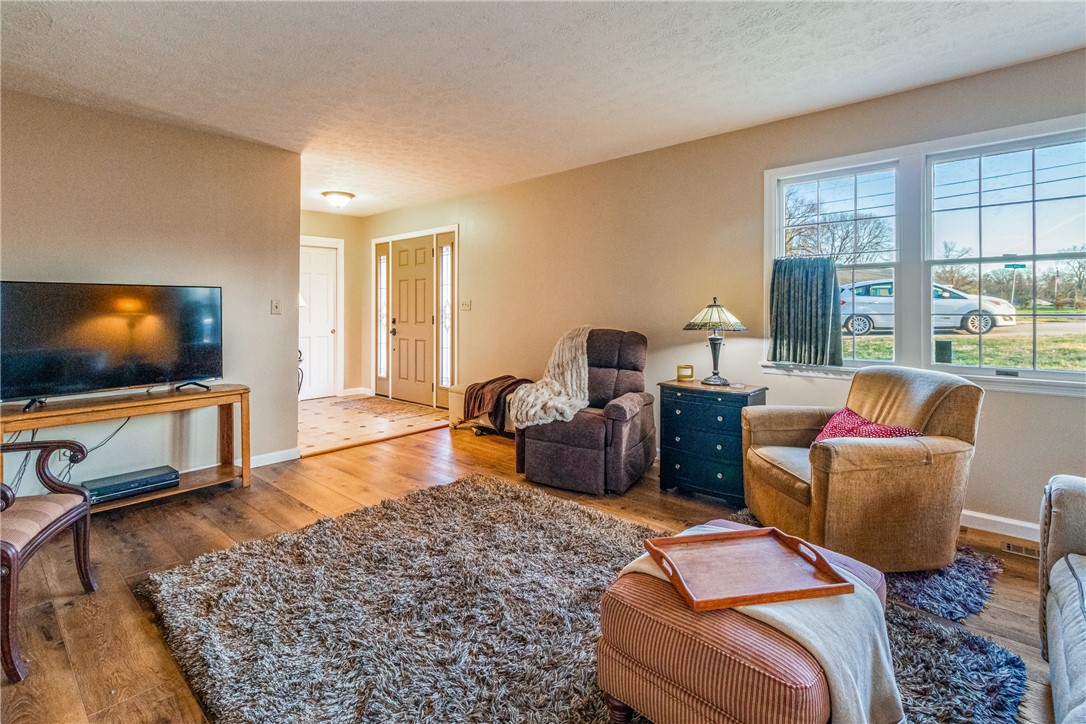 610 West Alex Bell Road Dayton, OH 45459 - Photo 5 of 36 This inviting room features warm wood flooring and ample natural light from large windows.