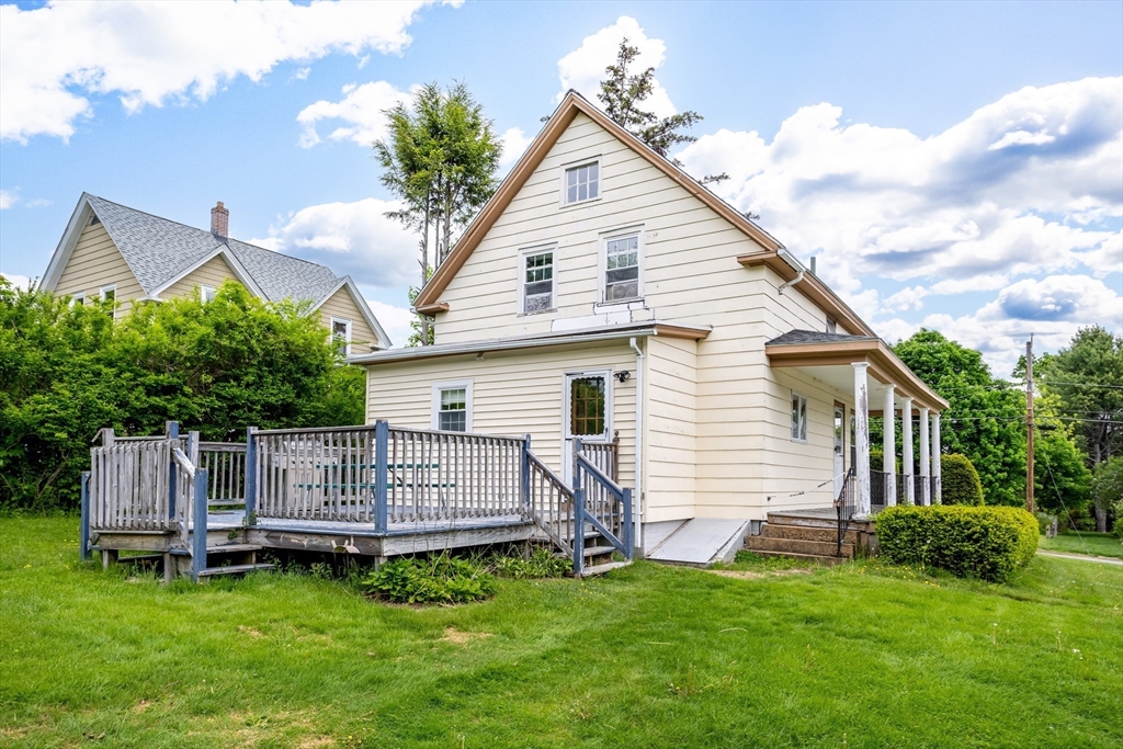 54 Charles Street Gardner, MA 01440 - Photo 32 of 40 a view of a house with a yard and deck