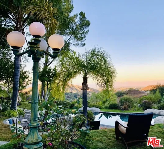 a view of a chairs and table in a patio